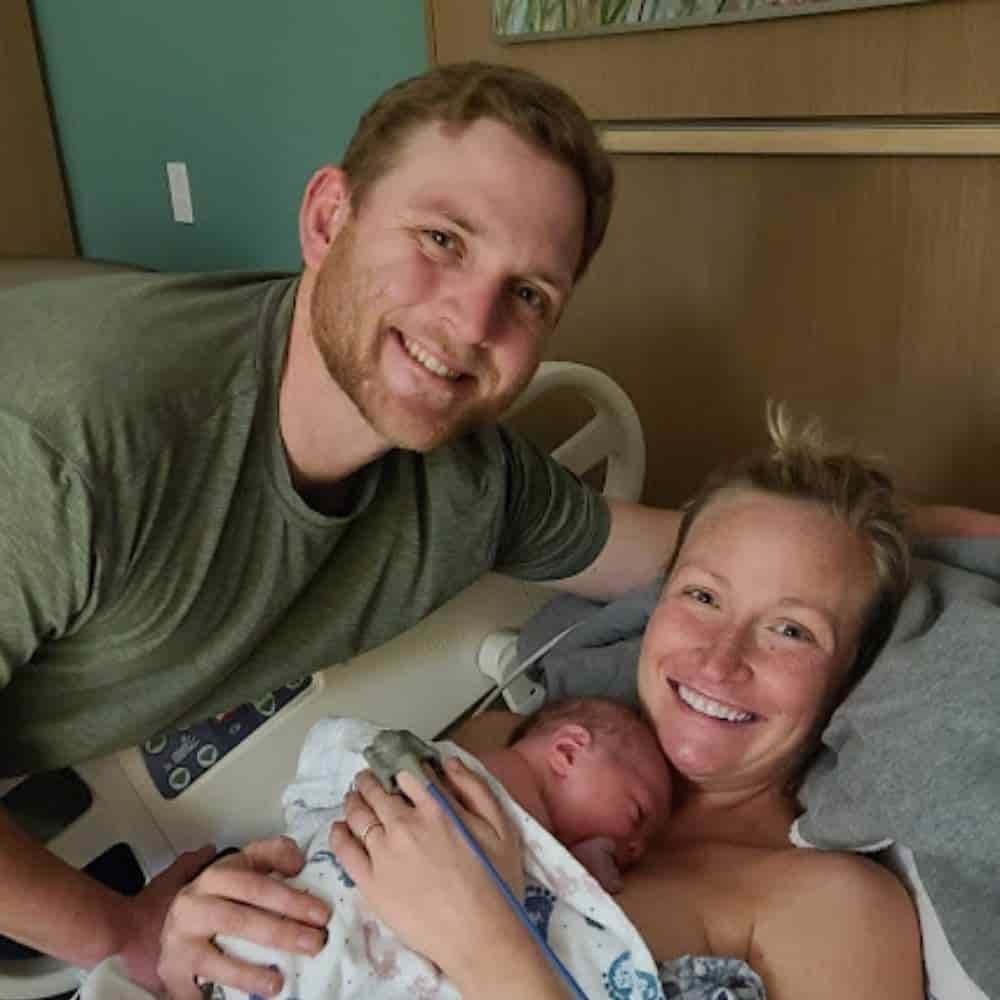 couple holding newborn baby